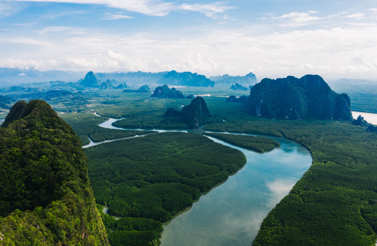 Aerial scenery view of mangroves forest, river canals and mountains. Ao Phang Nga bay National Park, Thailand By BullRun AdobeStock_374155848 Aerial scenery view of mangroves forest, river canals and mountains. Ao Phang Nga bay National Park, Thailand By BullRun