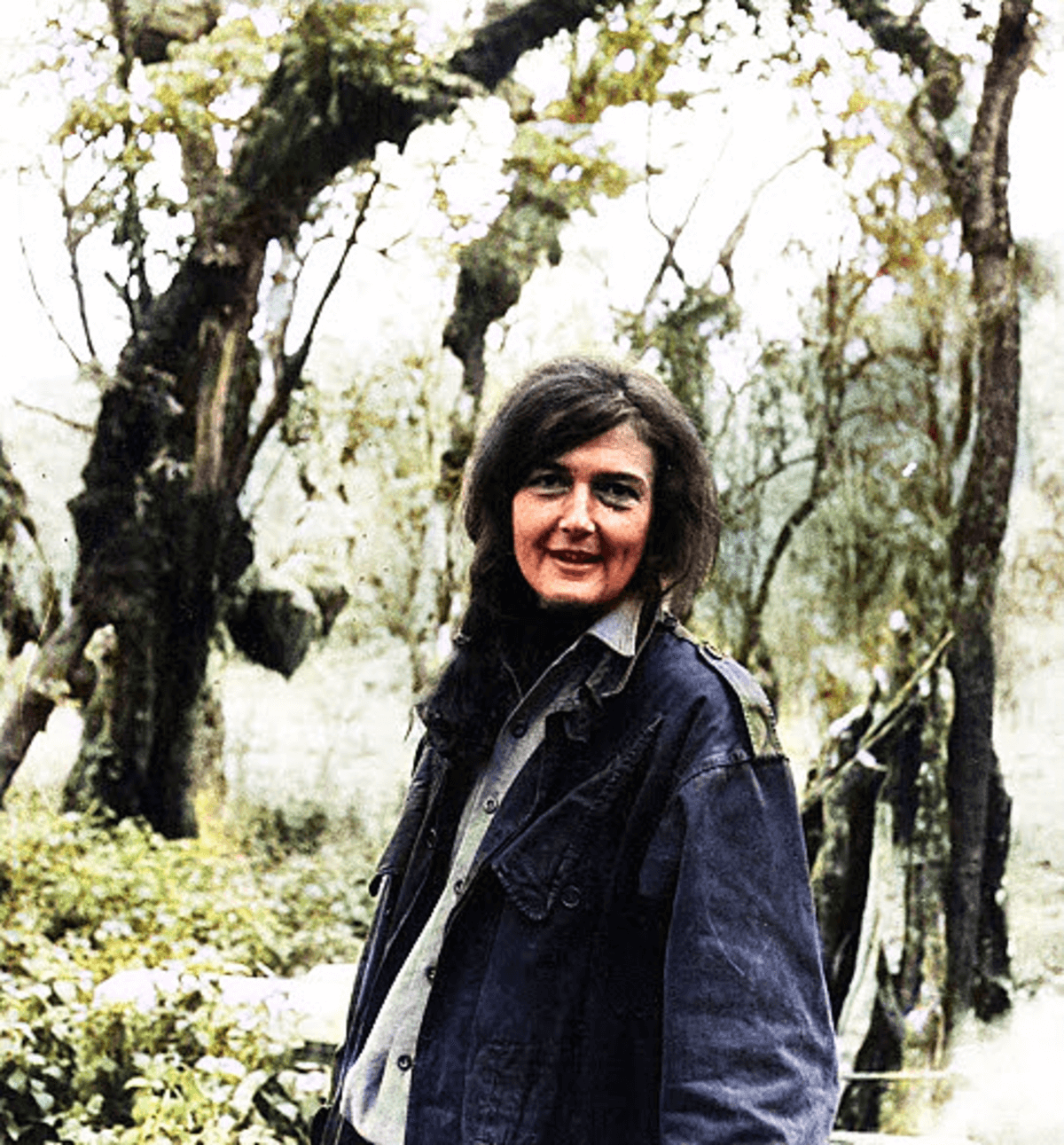 Dian Fossey posting in front of trees. Image credit: Courtesy of Dian Fossey Gorilla Fund Dian Fossey posting in front of trees. Image credit: Courtesy of Dian Fossey Gorilla Fund